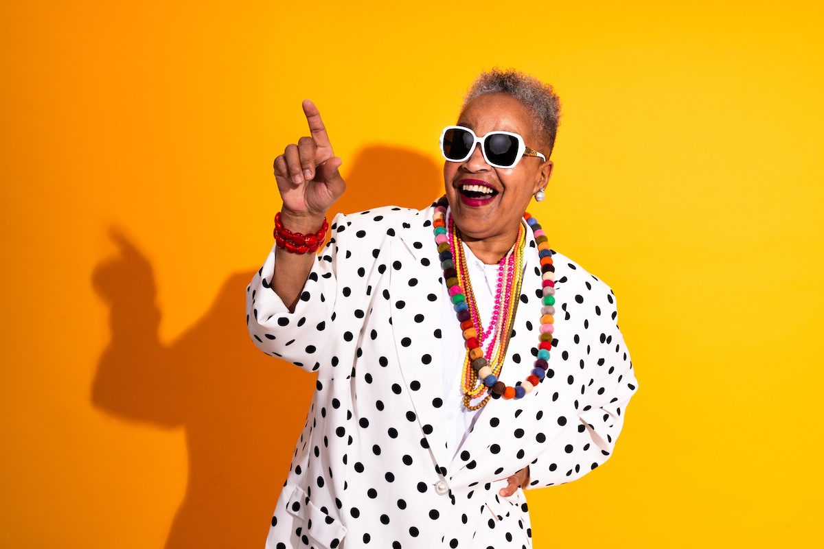 Black Friday Deals For Travel Colorful portrait of funny senior woman wearing stylish clothing