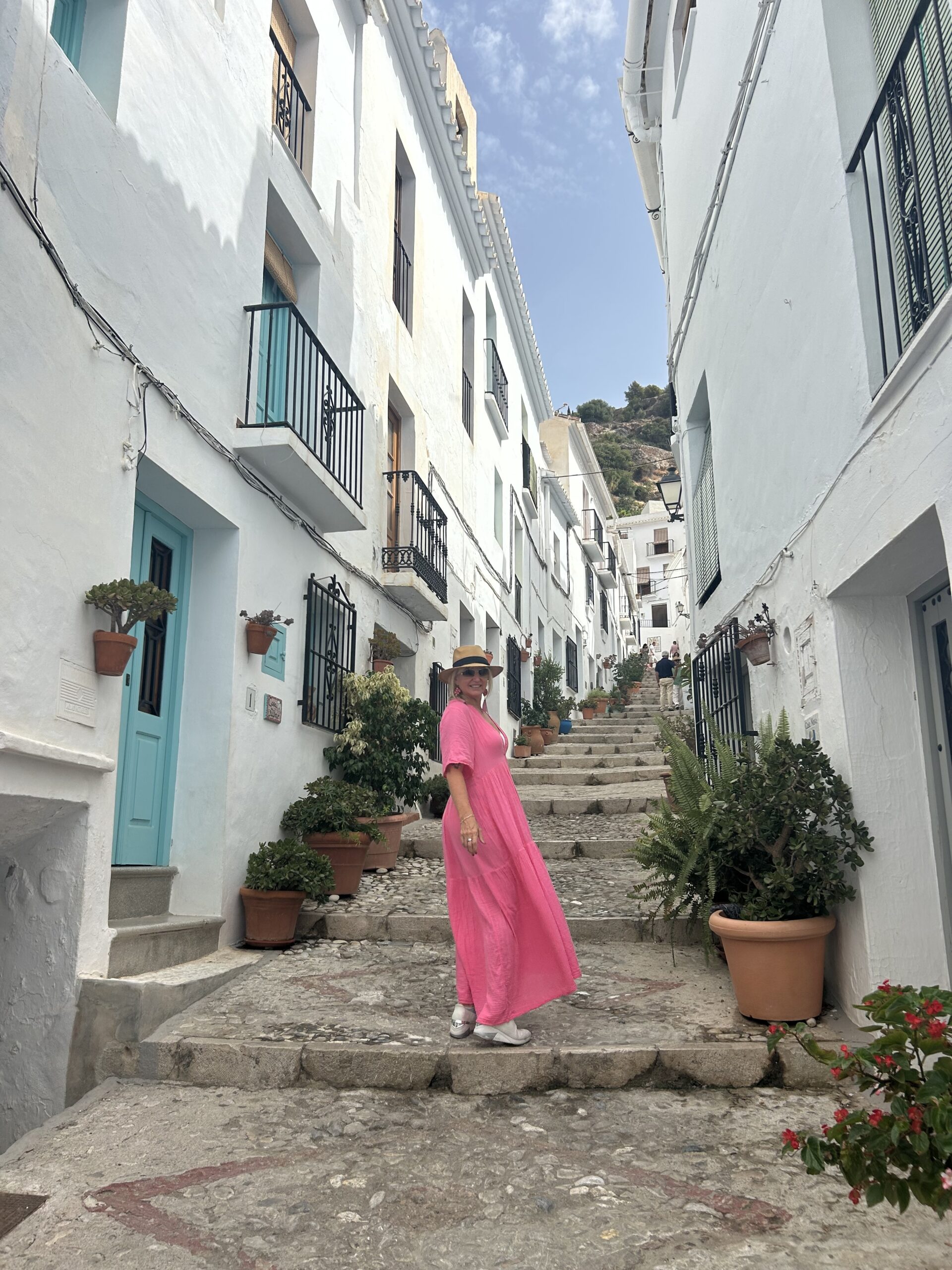 frigiliana spain woman on steps 