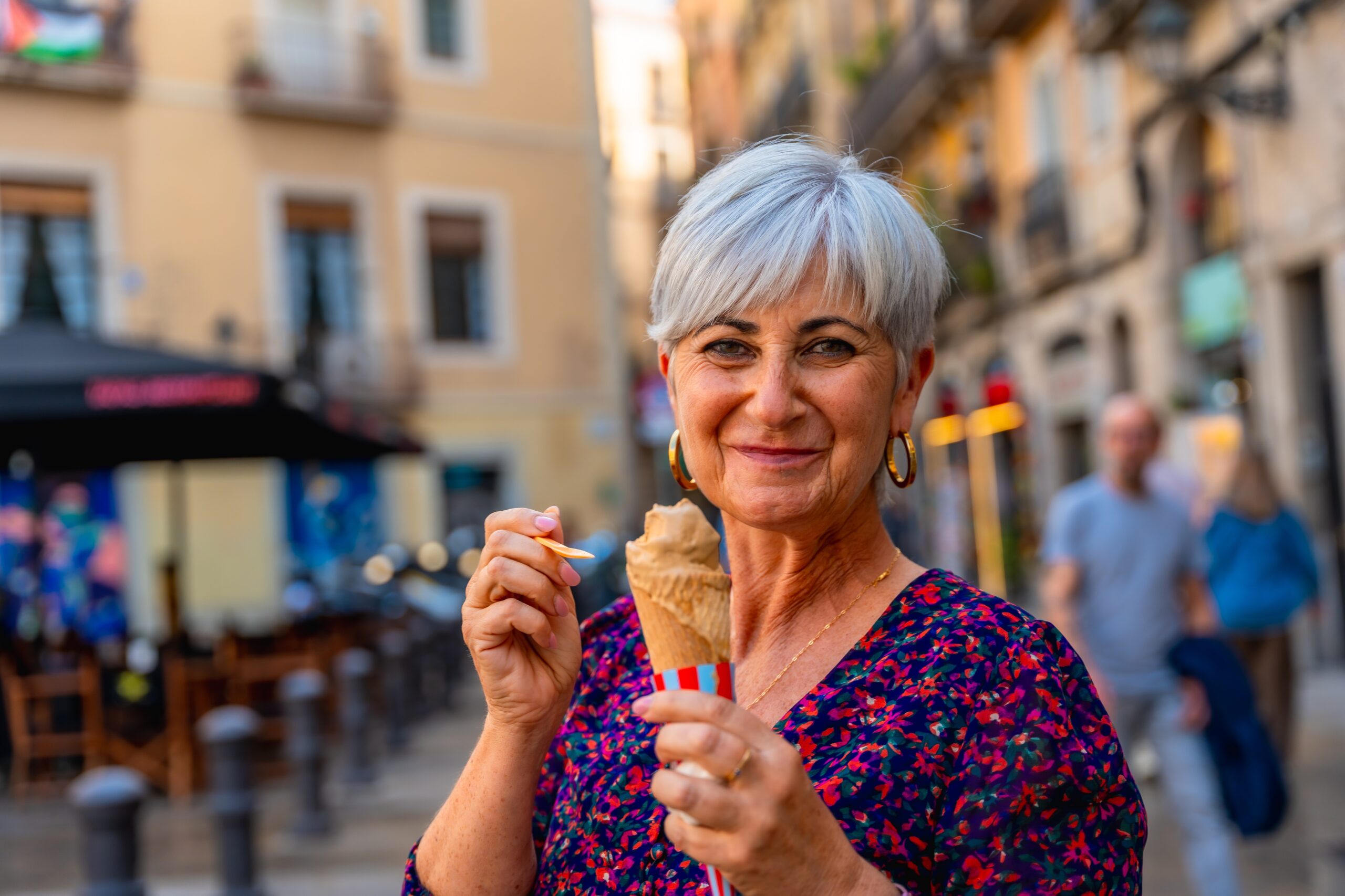 mature woman eating icea cream in europe by Unai82